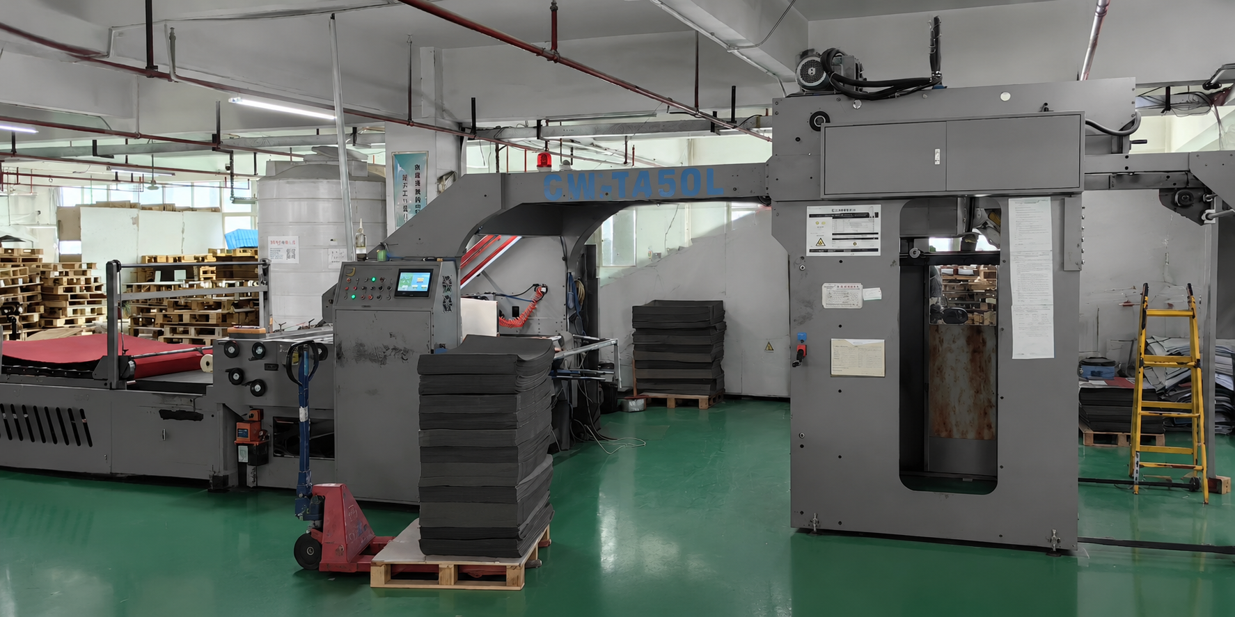 Board converting equipment on the XJY factory floor