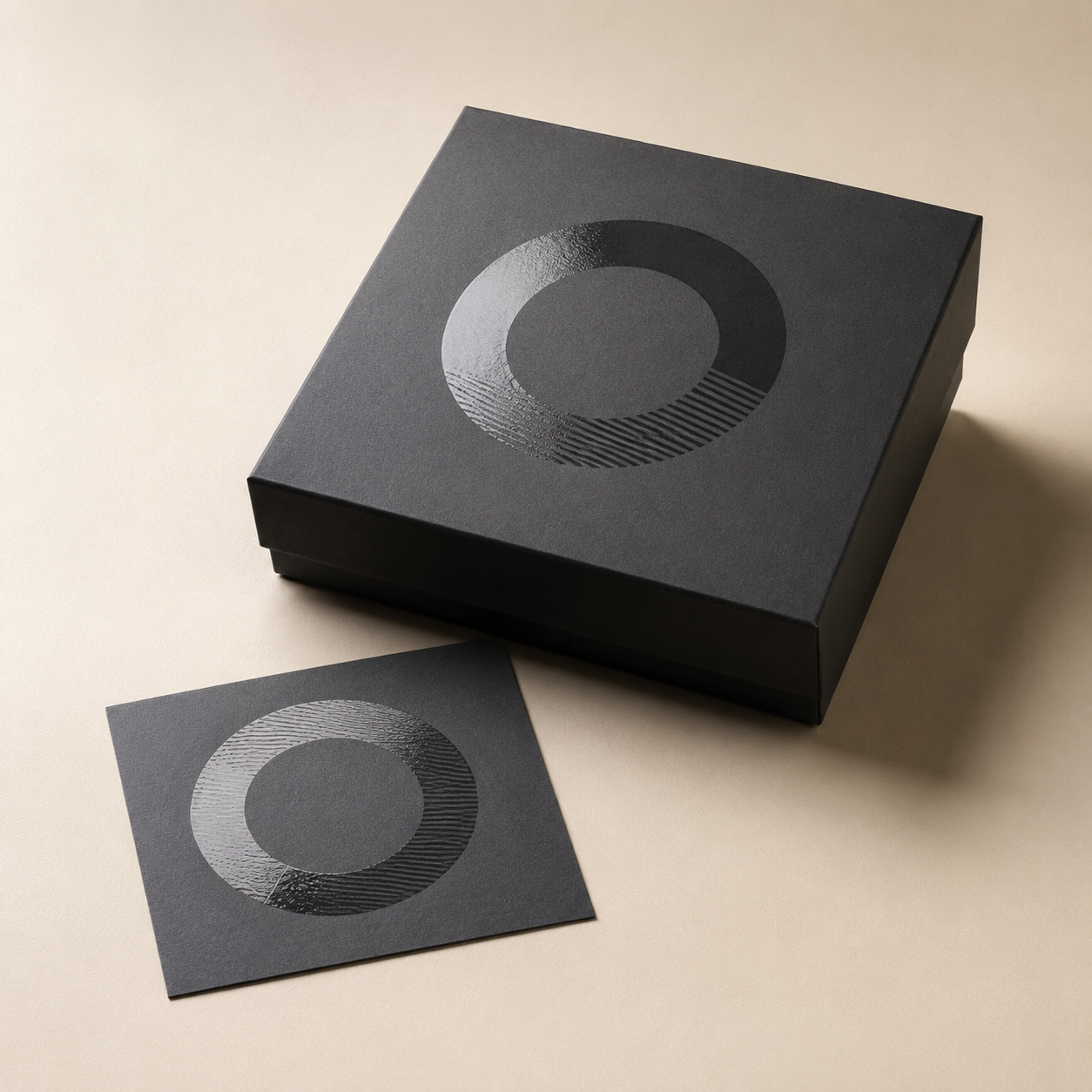 Representative charcoal paper box with selective glossy spot UV detail